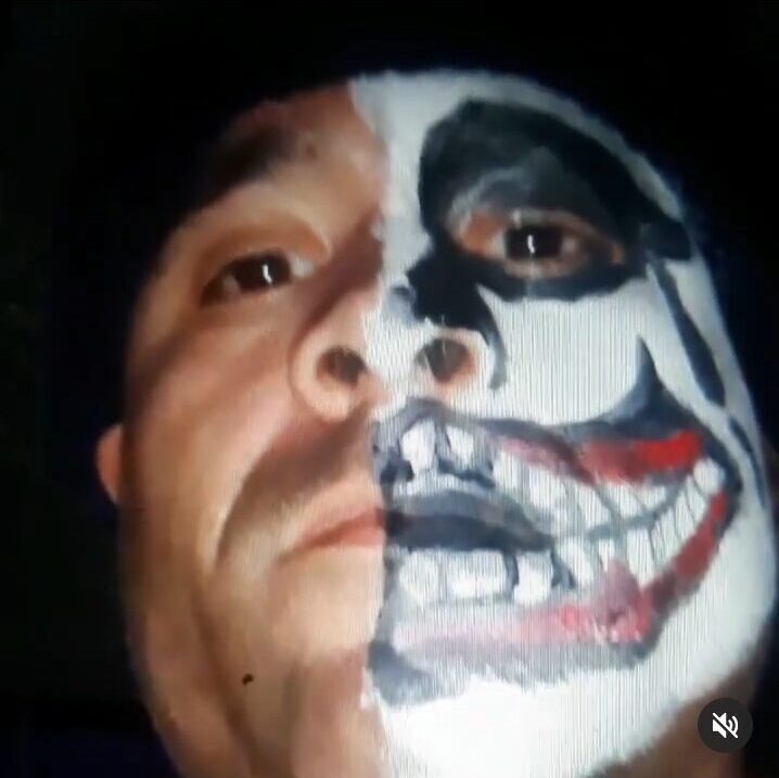 A man with his face painted